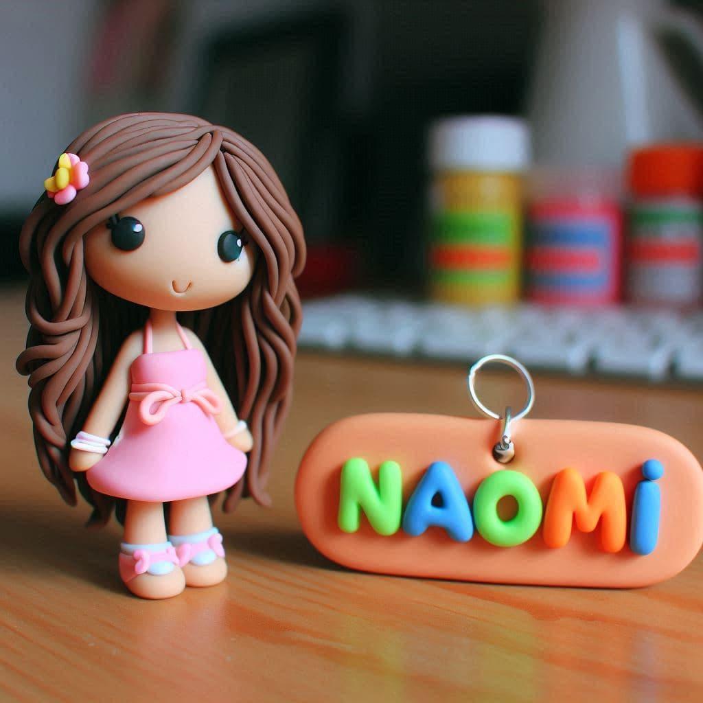 Une figurine en fimo d une fille personnalisee avec le prenom naomi 1