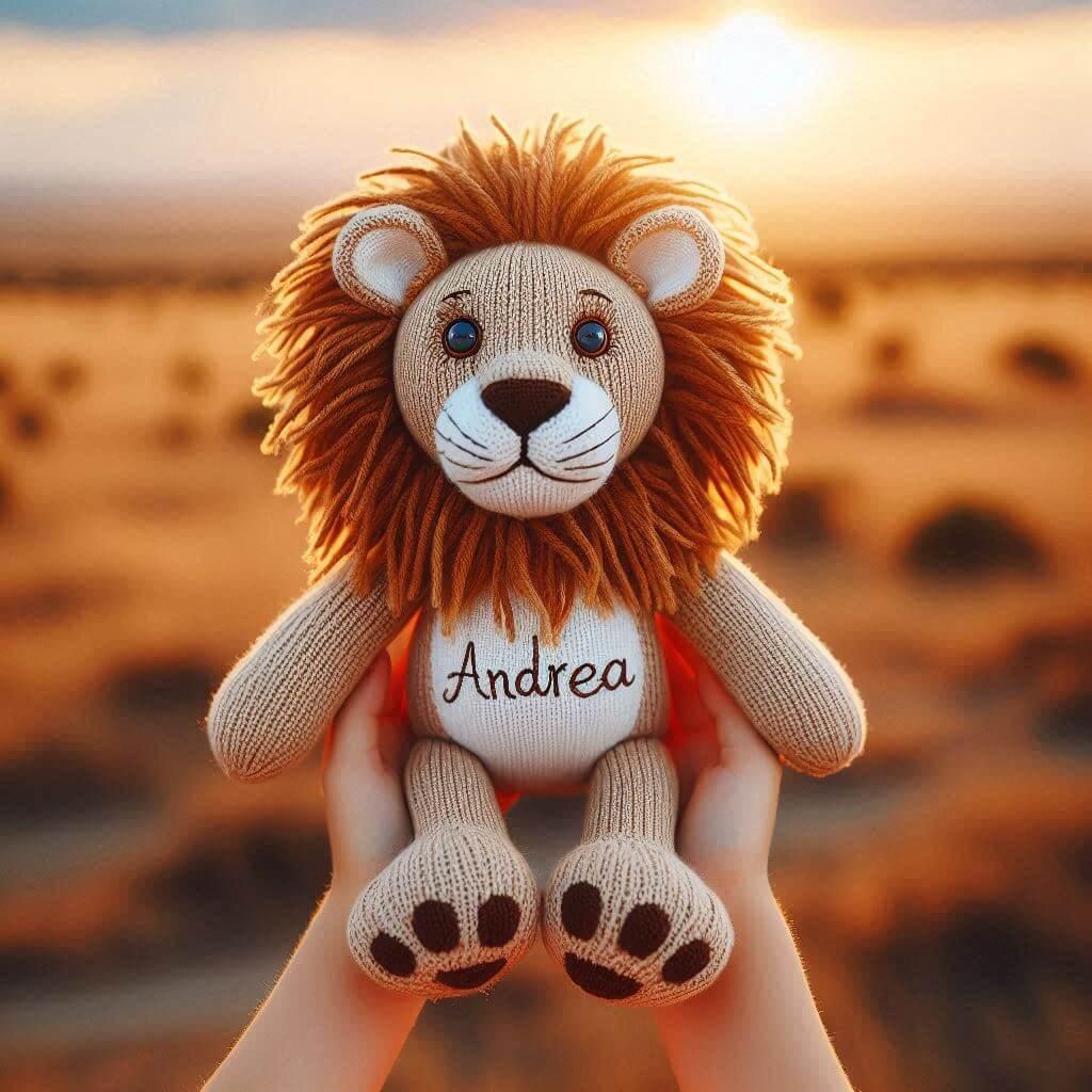 Une peluche lion en tricotin avec le prenom andrea
